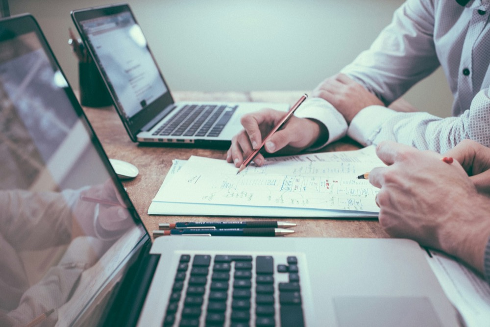 Advisors reviewing investment documents